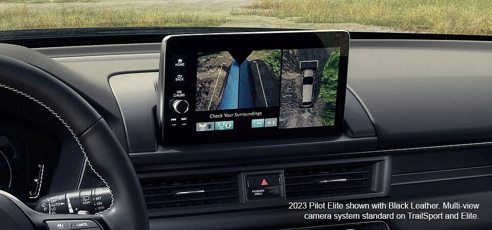 2023 Honda Pilot Elite shown with Black Leather. Multi-view camera system standard on TrailSport and Elite. Display screen with multi-view camera system turn on