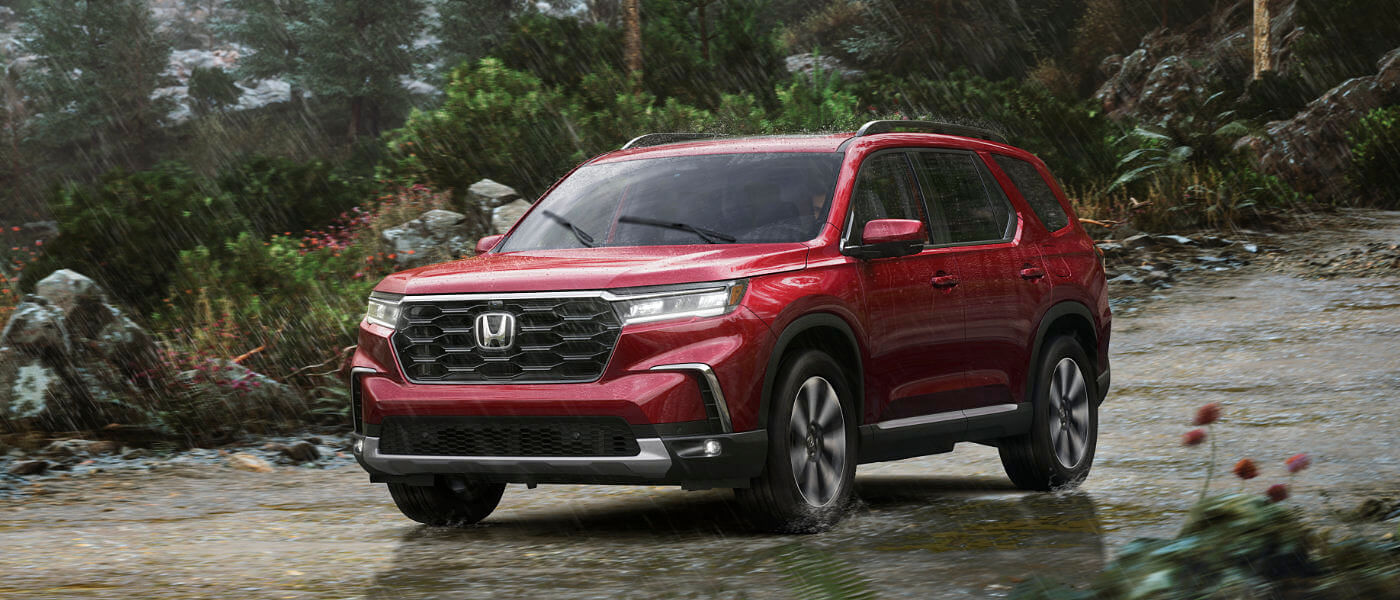 2024 Honda Pilot driving in the rain