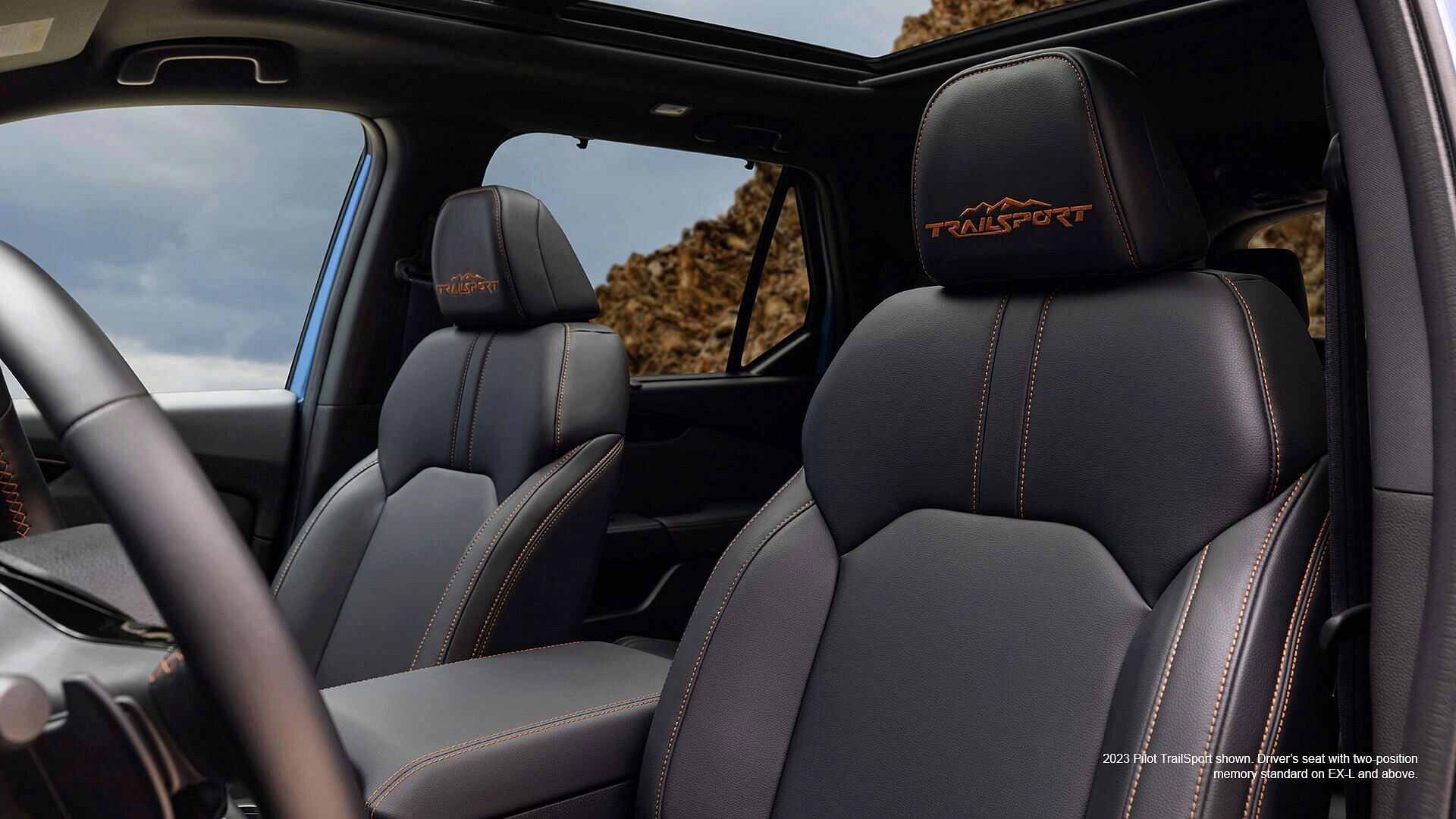 2023 Honda Pilot TrailSport shown. Driver's leather seat with two-position memory standard on EX-L and above.