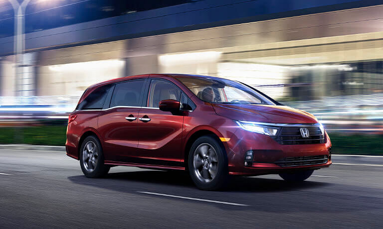 2024 Honda Odyssey driving fast with headlights